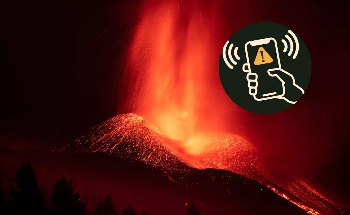 Símbolo del simulacro de Garachico sobre imagen de la erupción del volcán Tajogaite. /AH