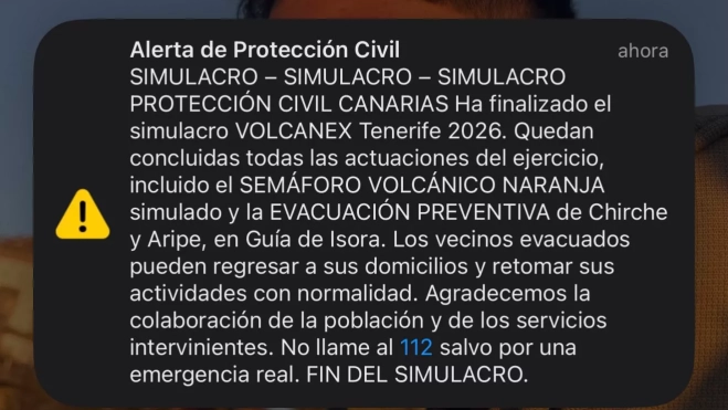 Imagen de la pantalla de un móvil con el aviso de Protección Civil sobre el fin del simulacro. / ATLÁNTICO HOY